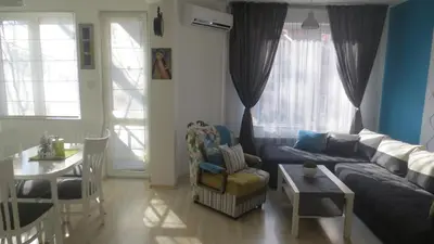 a living room with a couch and a table at Apartment Sophie in Plovdiv