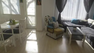 a living room with a couch and a table at Apartment Sophie in Plovdiv