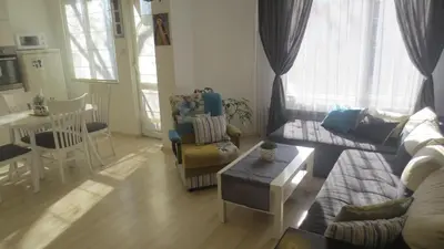 a living room with a couch and a table at Apartment Sophie in Plovdiv