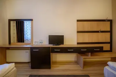 a room with a desk with a television on it at Complex Jitari in Zhitnitsa