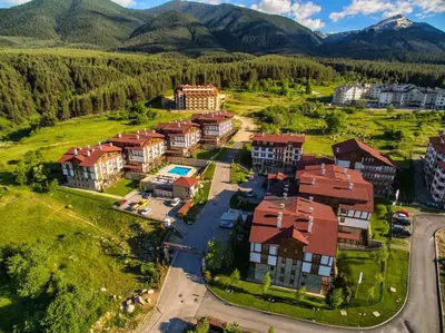 an aerial view of a resort with mountains in the background at Forest View Apartment C34 Bansko in Bansko