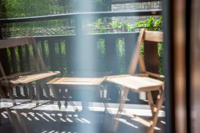 a pair of chairs sitting on a porch at 650m Ski in&out - Studio - FREE SPA and Parking in Bansko