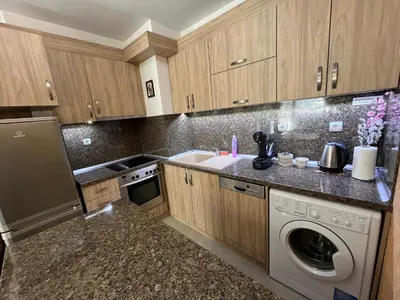 a kitchen with a washing machine and a sink at Ideal Center by the Park - Walk to Kapana in Plovdiv