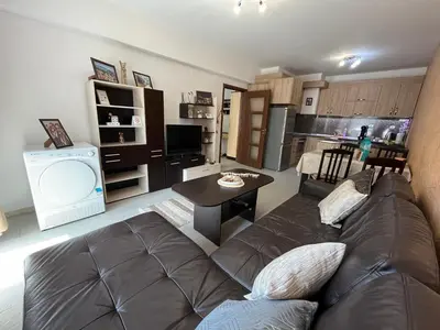 a living room with a couch and a table at Ideal Center by the Park - Walk to Kapana in Plovdiv