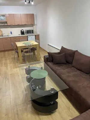 a living room with a couch and a table at PAMPOROVO Raikovski lodge in Pamporovo