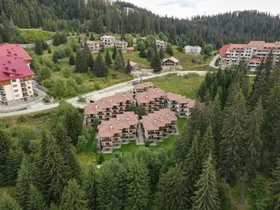 an aerial view of a resort with trees and buildings at PAMPOROVO Raikovski lodge in Pamporovo