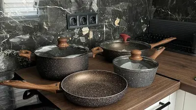 three pots and pans on a counter in a kitchen at Chill Out Urban Studio in Plovdiv