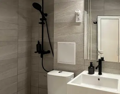 a bathroom with a shower and a toilet and a sink at Chill Out Urban Studio in Plovdiv