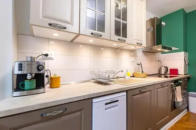 a kitchen with a counter top with a microwave at Central Family Apt Fuzzy Muzzy 2 bedrooms MU University in Plovdiv