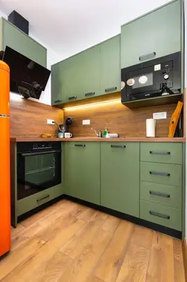 a kitchen with green cabinets and a stove at Hidden Gem in the Heart of Plovdiv in Plovdiv