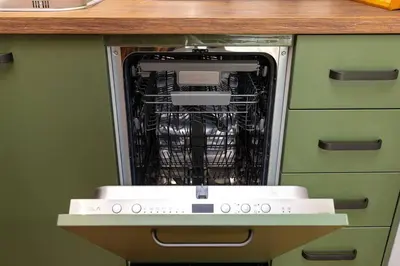a dishwasher with its door open in a kitchen at Hidden Gem in the Heart of Plovdiv in Plovdiv