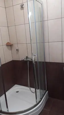 a shower with a glass enclosure in a bathroom at Hotel Grand Resor Pamporovo in Pamporovo
