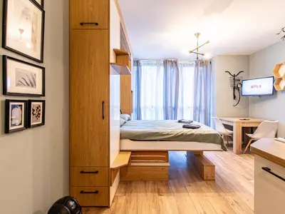 a bedroom with a bed and a desk at Stay & Explore Sofia - Central Studio in Sofia