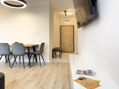 a dining room with a table and chairs at 2BR Business Suite with FREE GYM, by Holiwork Stays in Plovdiv
