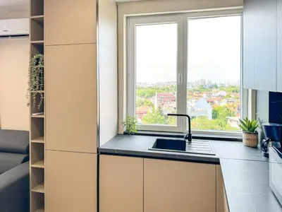 a kitchen with a sink and a window at 2BR Business Suite with FREE GYM, by Holiwork Stays in Plovdiv