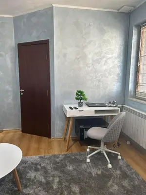 an office with a desk and a chair and a door at 1-Bedroom apt - BathTub - 10mins from SkiLift Gondola - freeWiFi - WorkDesk - Central Heating - Full Kitchen at Edelweiss in Bansko