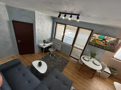 an overhead view of a living room with a couch and chairs at 1-Bedroom apt - BathTub - 10mins from SkiLift Gondola - freeWiFi - WorkDesk - Central Heating - Full Kitchen at Edelweiss in Bansko
