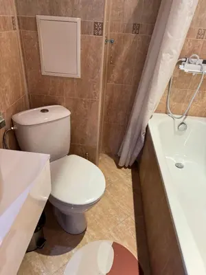 a bathroom with a toilet and a sink and a tub at 1-Bedroom apt - BathTub - 10mins from SkiLift Gondola - freeWiFi - WorkDesk - Central Heating - Full Kitchen at Edelweiss in Bansko