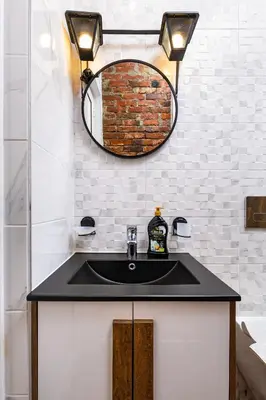 a bathroom with a black sink and a mirror at The Urban Nest-2BD Apartment with a Terrace by Flat Mаnager in Plovdiv