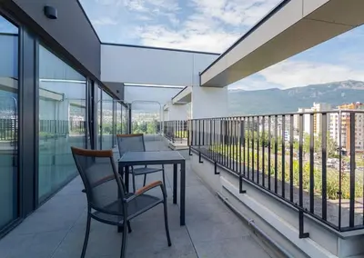 a balcony with a table and chairs on it at My Campus 1 bdrm, Romantic, Panorama view, Free parking, Self check-in in Sofia