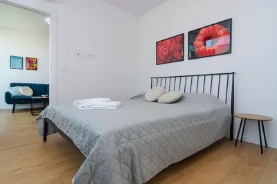 a bedroom with a bed with two pillows on it at My Campus 1 bdrm, Romantic, Panorama view, Free parking, Self check-in in Sofia