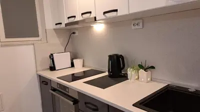 a kitchen with a coffee maker on a counter at Apart Viki in Sandanski
