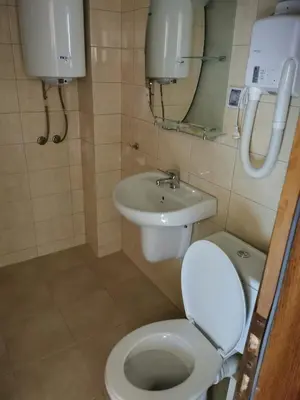 a bathroom with a toilet and a sink at ICEBERG Ski Apartment No19 in Pamporovo
