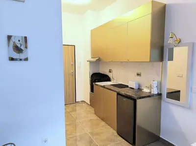 a kitchen with a counter top in a room at My Campus Studios, free parking, self-check in in Sofia