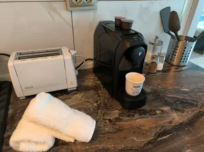 a kitchen counter with a coffee maker and a toaster at My Campus Studios, free parking, self-check in in Sofia