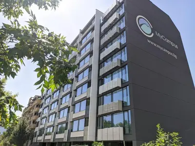 a building with a sign in front of it at My Campus Studios, free parking, self-check in in Sofia