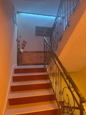 a set of stairs with a blue light on them at Пандова къща in Sandanski