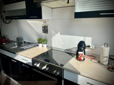 a kitchen with a sink and a counter top at Cozy APT Free Parking Wi-Fi Netflix in Sofia