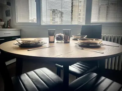 a table with plates and glasses on top of it at Cozy APT Free Parking Wi-Fi Netflix in Sofia