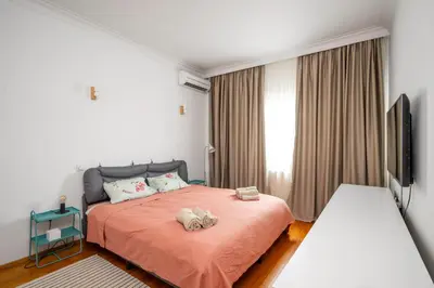 a bedroom with a bed with two stuffed animals on it at Charming 2BD Apartment in the Heart of the City by Flat Mаnager in Sofia