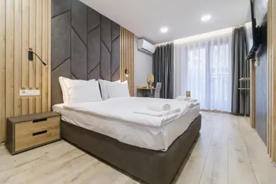 a bedroom with a large bed in a room at LDV 13 Residence Free private parking in Plovdiv