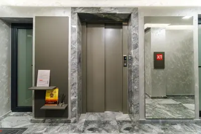 a hallway with two elevators in a building at LDV 13 Residence Free private parking in Plovdiv