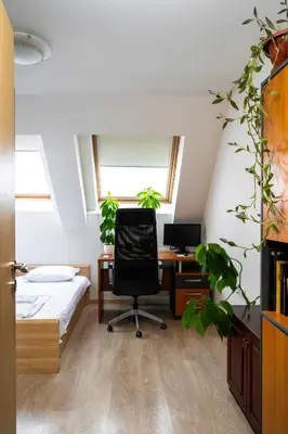 an attic office with a desk and a chair at Spacious 2BD Flat with Secure Free Parking by Flat Mаnager in Sofia