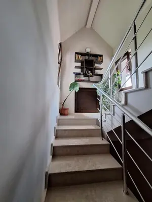 a staircase in a house with a potted plant at Guest House Vessyta in Sapareva Banya