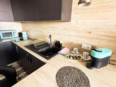 a kitchen with a sink and a plate of food at Best View Studio in Sofia