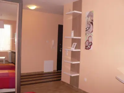 a room with a wall with shelves and a mirror at Stay Nexus Galaxy Center in Sofia