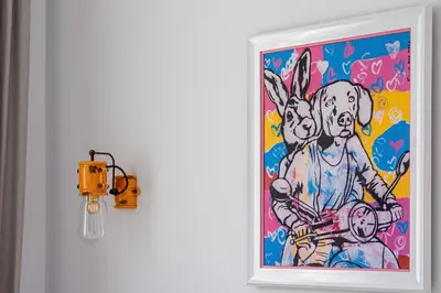 a painting of a bunny on a door with a light at Vespa Home Boutique Apartment in Sofia