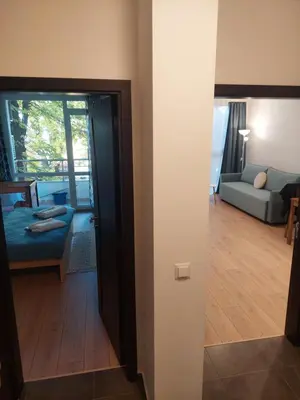 a room with a door open to a living room at Sky Hills 2 Apartment in Sandanski
