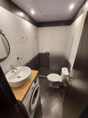 a bathroom with a sink and a toilet at Sky Hills 2 Apartment in Sandanski