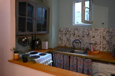a kitchen with a stove and a sink at National Theatre Loft in Sofia