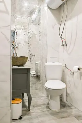 a white bathroom with a toilet and a sink at Velar 1BDR Apartment in Sofia