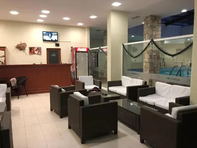 a waiting room with couches and a glass table at Spacious 2 Bed Apartment Close To Gondola in Bansko