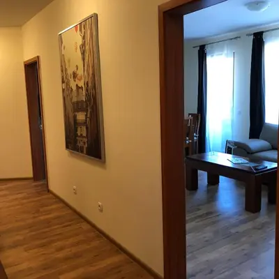 a living room with a couch and a table at Spacious 2 Bed Apartment Close To Gondola in Bansko