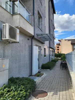 an apartment building with an air conditioner on the side of it at Апартамент Димана in Hisarya