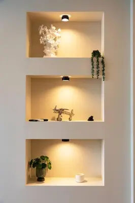 a white shelf with a sink and plants on it at Olive Green Designer Apartment in Plovdiv