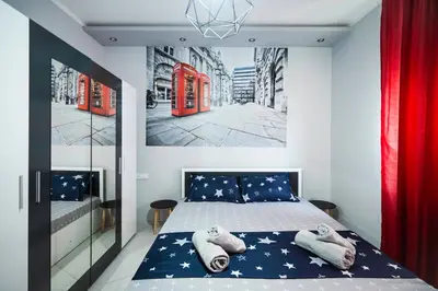 a bedroom with a bed with stars on it at Feel Right at Home - Bright and Modern Apartment by Flat Mаnager in Sofia